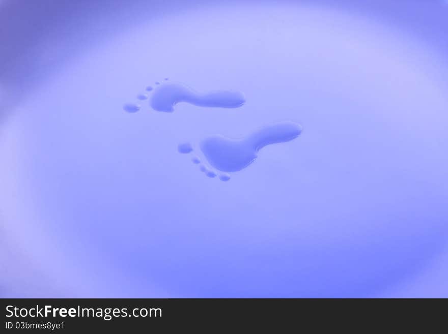 Wet small footsteps close up. Wet small footsteps close up