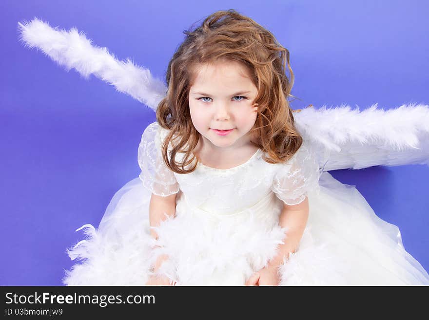 Beautiful girl in a white dress with angel wings. Beautiful girl in a white dress with angel wings