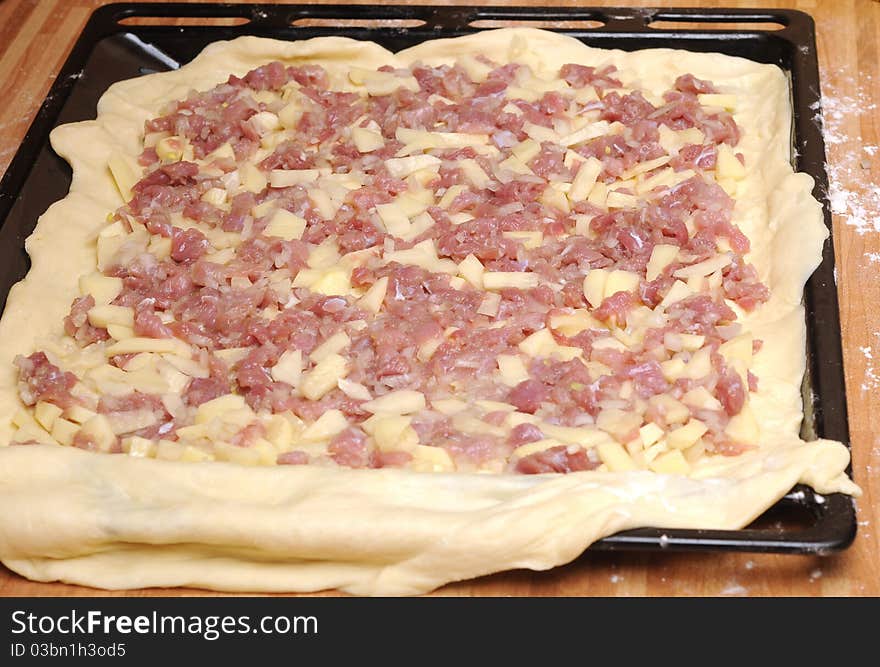 Raw meat pie is ready to bake in oven stove