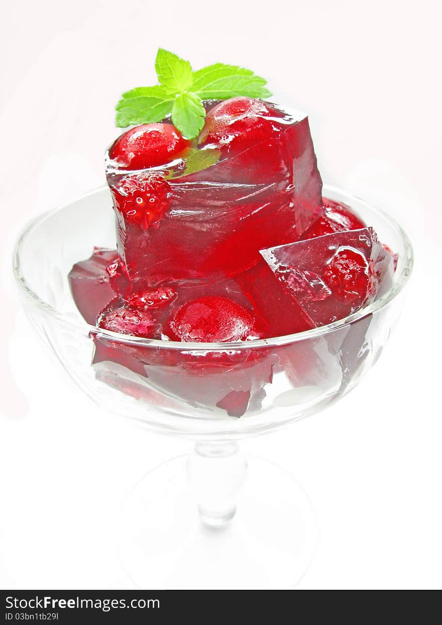 Red colored marmalade dessert with cherry. Red colored marmalade dessert with cherry