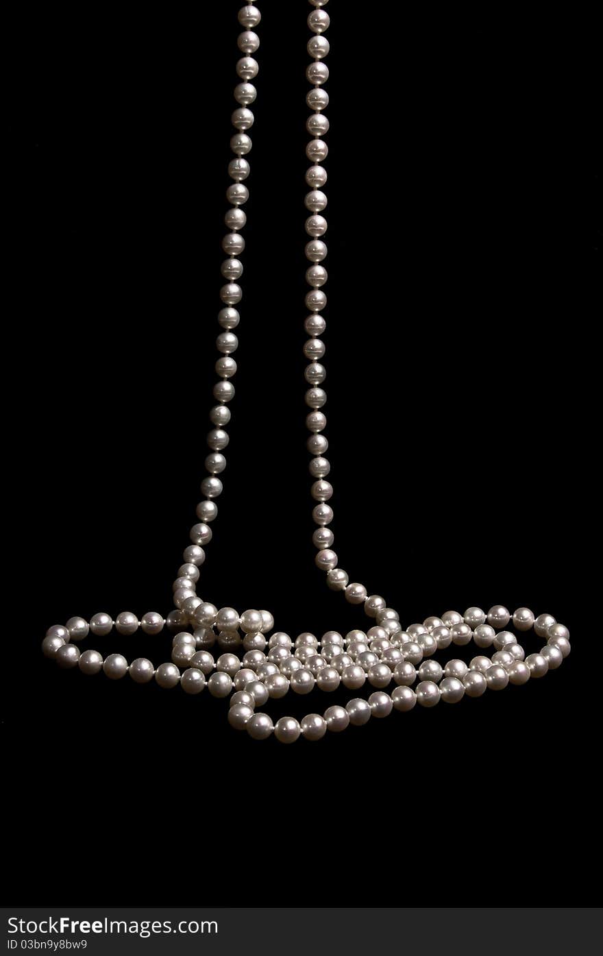 Pearl beads on a black