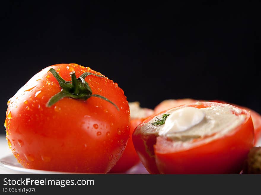 Tomato stuffed with vegetable filling. Tomato stuffed with vegetable filling