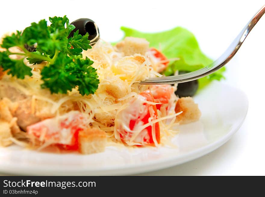 A salad in a stylish white bowl. A salad in a stylish white bowl.