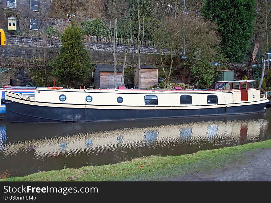 An old narrowboat on the Rochdale Canal at Hebden Bridge. An old narrowboat on the Rochdale Canal at Hebden Bridge