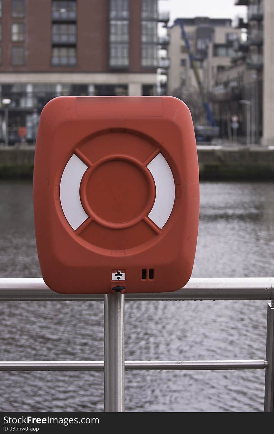 Life bouy cabinet next to the river. Life bouy cabinet next to the river