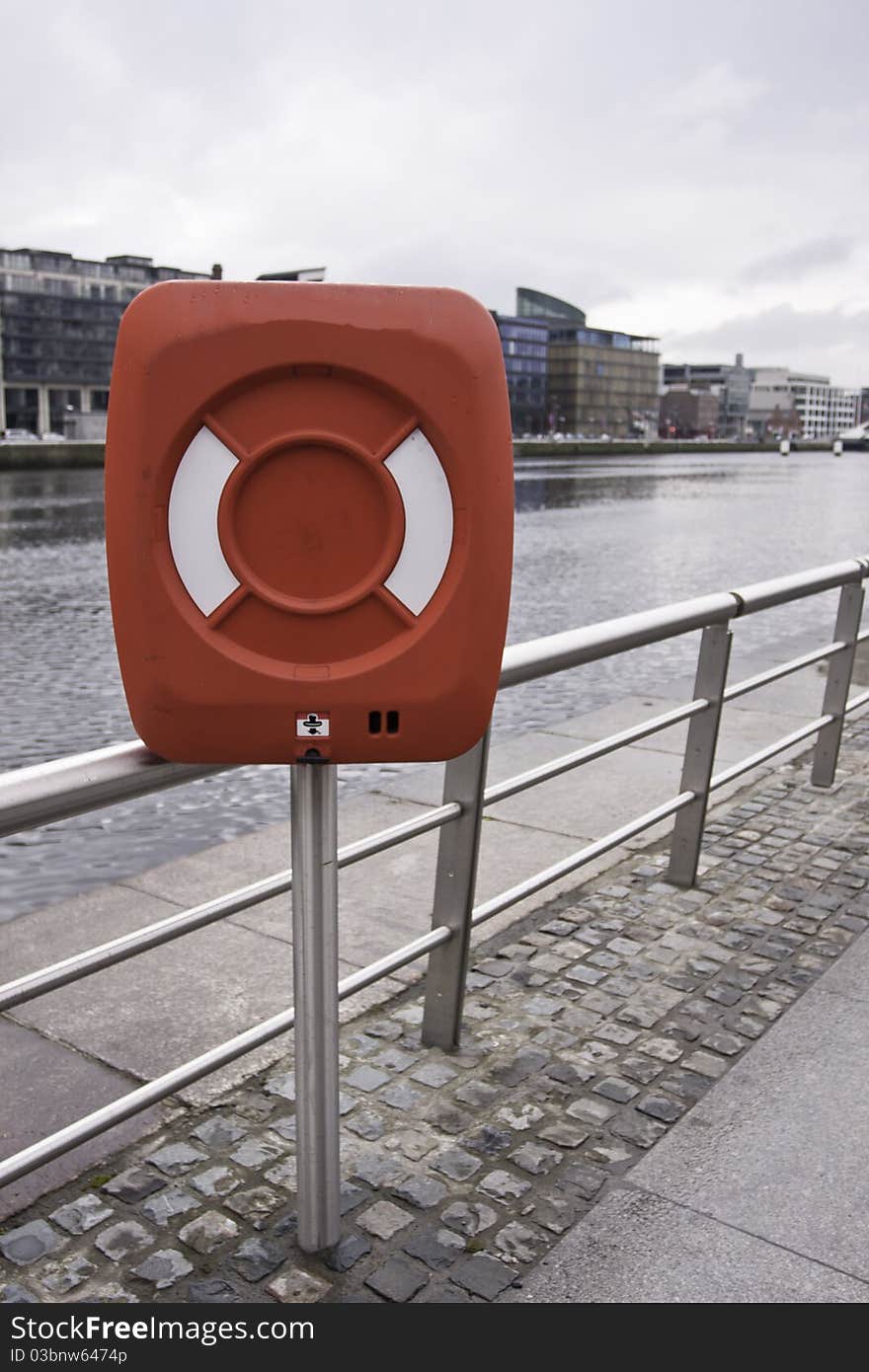 Life bouy cabinet next to the river. Life bouy cabinet next to the river