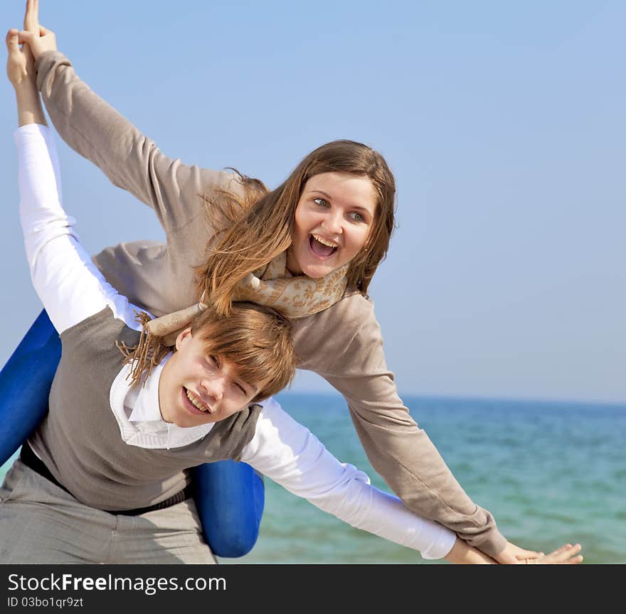 Young couple having fun on the beach.