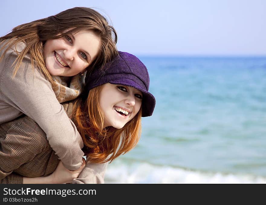 Two Happy Girls At Spring Beach.