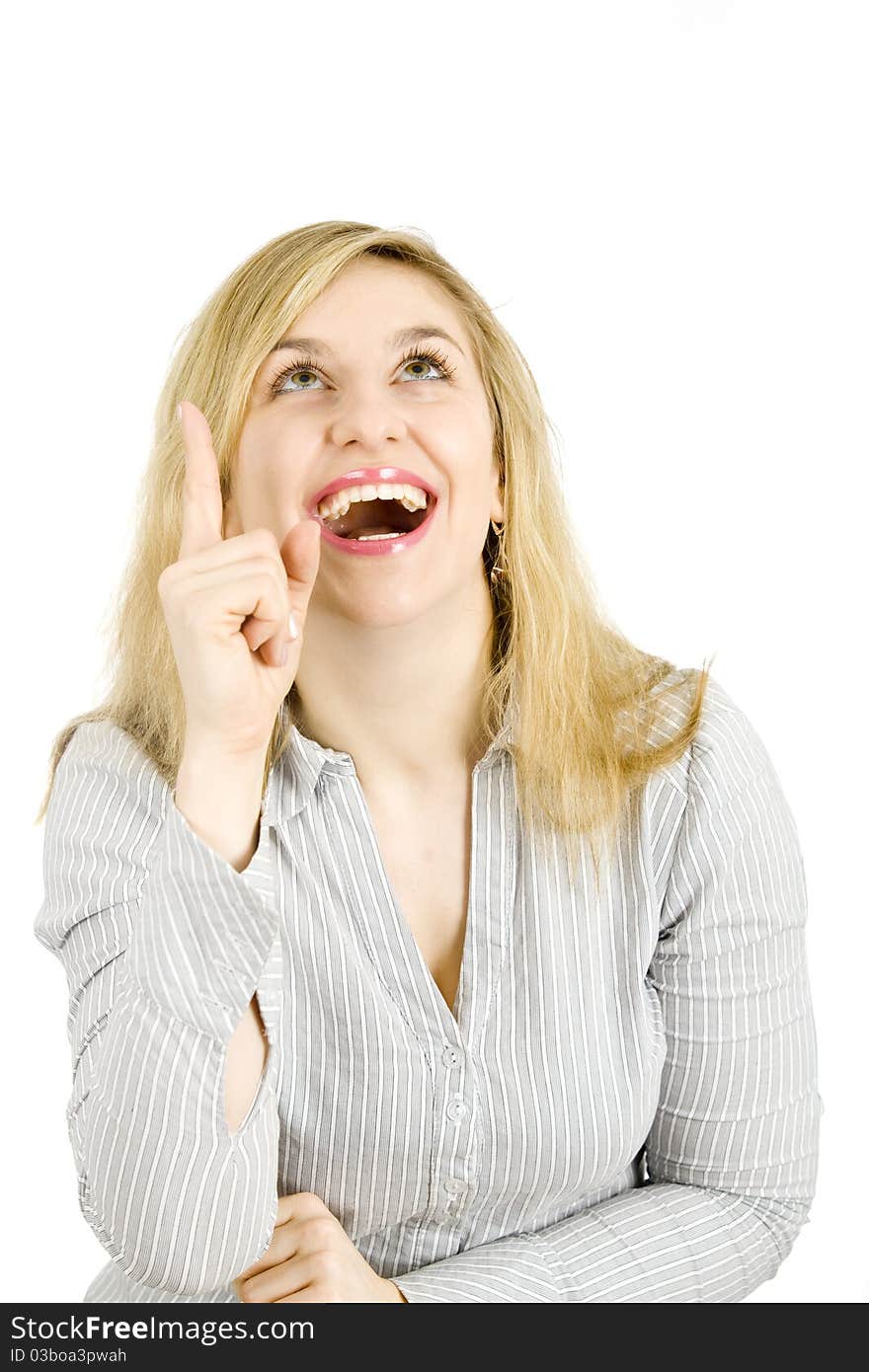 Young businesswoman standing in confident pose, with her finger pointing up, looking up