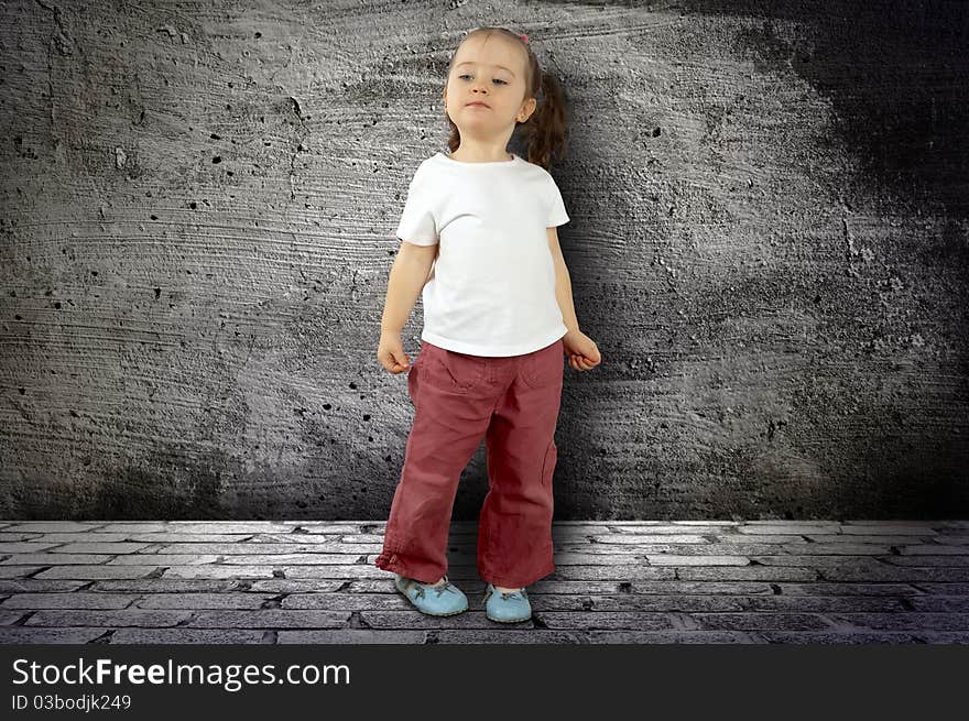 The small child against a wall