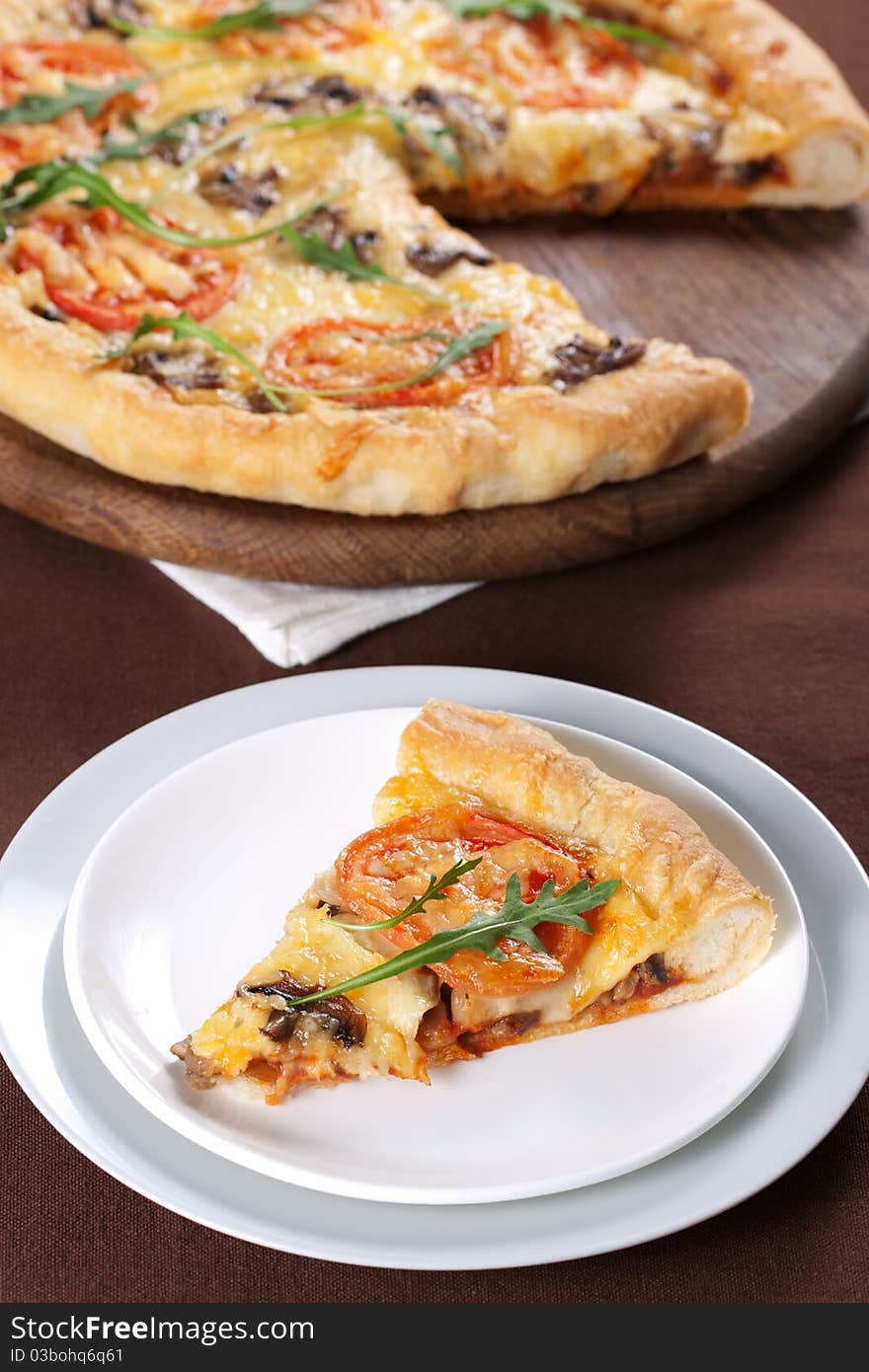 Pizza with mushroom and tomatoes