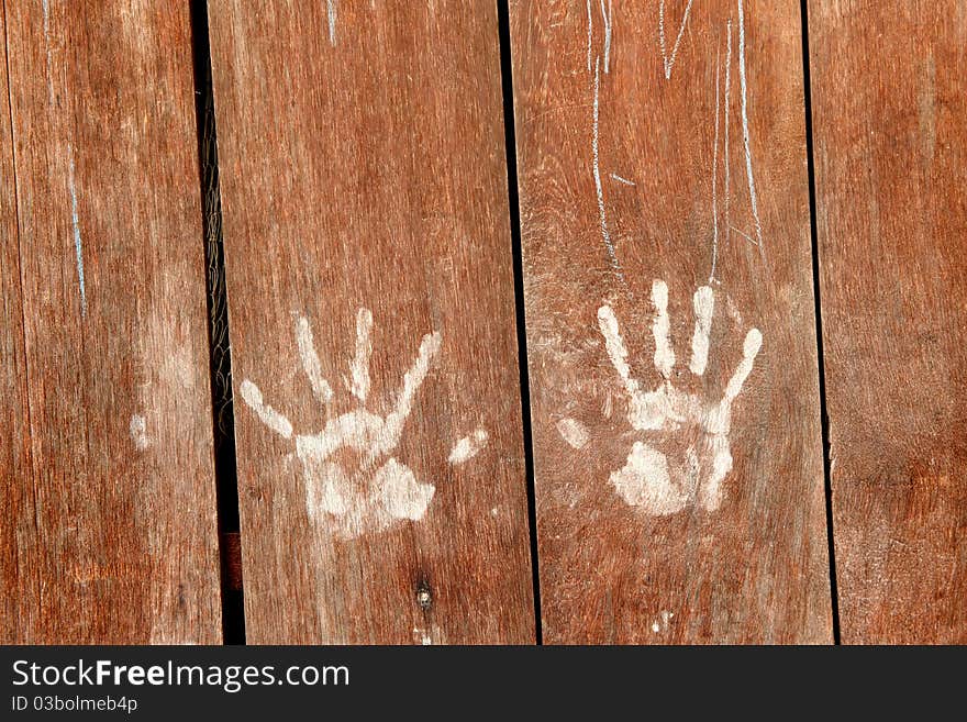 Blown wood wall with white hand print. Blown wood wall with white hand print