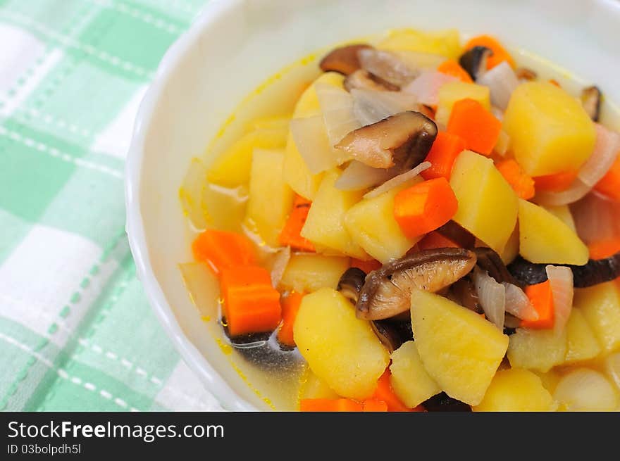 Homemade potato stew cooked with carrots and mushrooms. Homemade potato stew cooked with carrots and mushrooms.