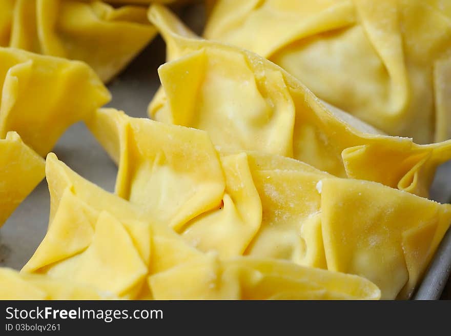 Macro shot of wanton dumpling skin. Commonly found in Chinese cuisine. Macro shot of wanton dumpling skin. Commonly found in Chinese cuisine.