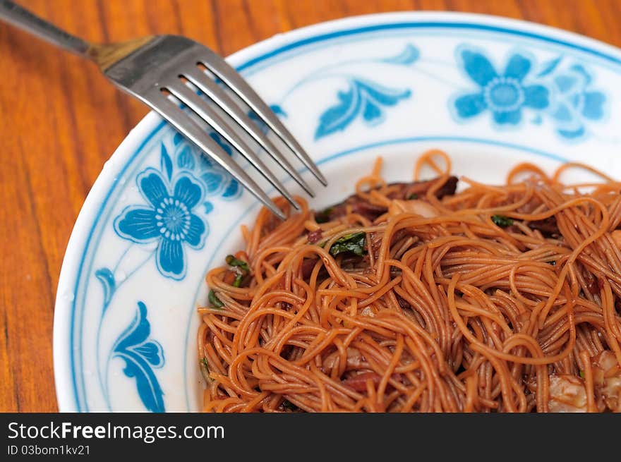 Asian vegetarian bee hoon meal served in Oriental style plate. Asian vegetarian bee hoon meal served in Oriental style plate.