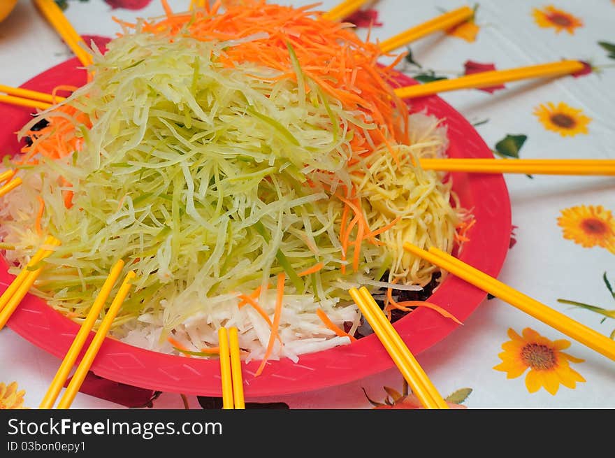 Unique Chinese New Year delicacy prepared with healthy raw vegetables of various kinds. Popular during the new year as a symbol of good luck. Unique Chinese New Year delicacy prepared with healthy raw vegetables of various kinds. Popular during the new year as a symbol of good luck.