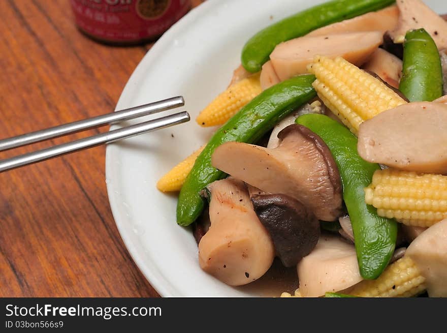 Simple Chinese style dish with healthy mushrooms and mixed vegetables. Simple Chinese style dish with healthy mushrooms and mixed vegetables.