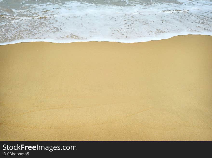 White foam on a beach - background texture. White foam on a beach - background texture