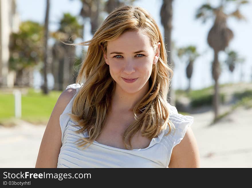 Young woman at the beach on a sunny day. Young woman at the beach on a sunny day