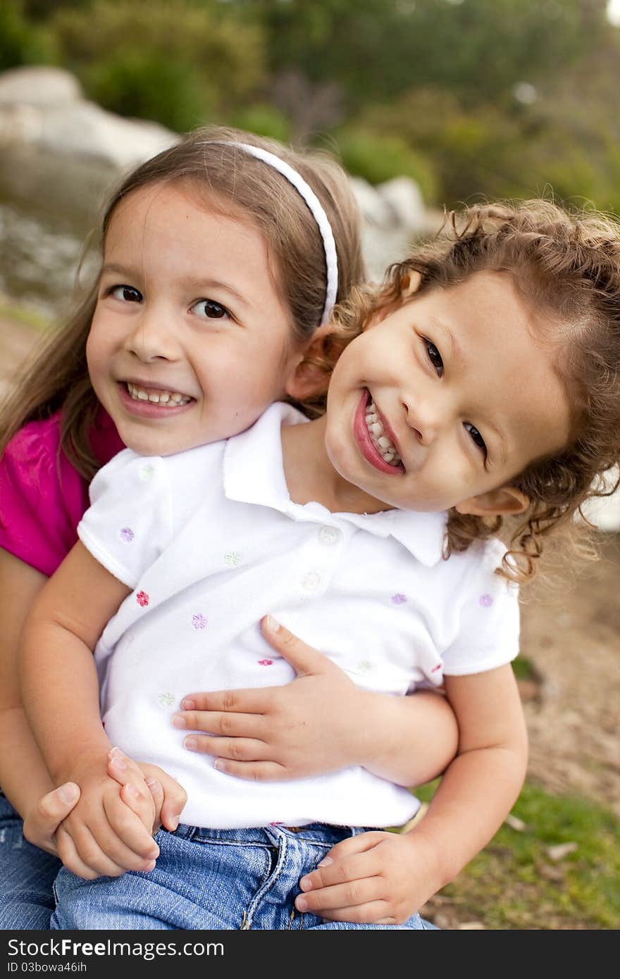 Cute little sisters playing outside