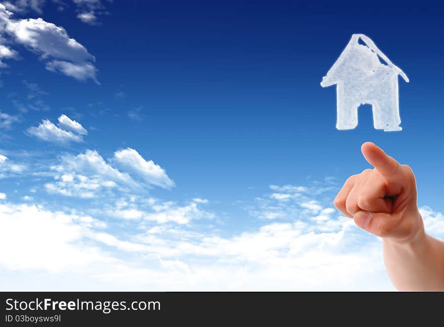 The House in the hands against the blue sky as a symbol of the real estate business