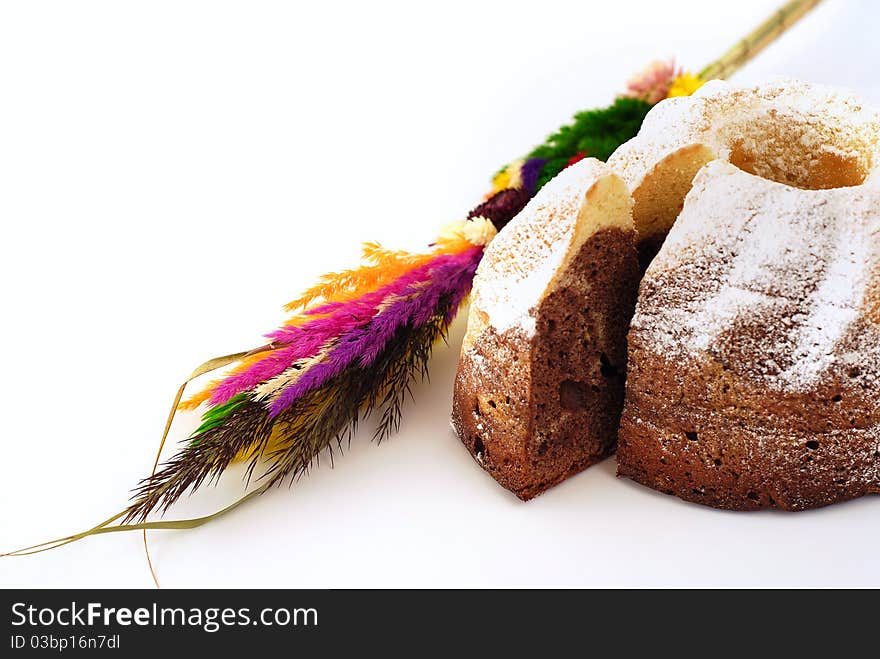 Easter palm with a piece of cake on the white background. Easter palm with a piece of cake on the white background