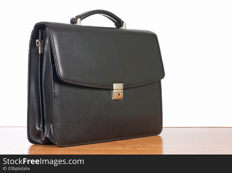 Fashionable leather briefcase on a table