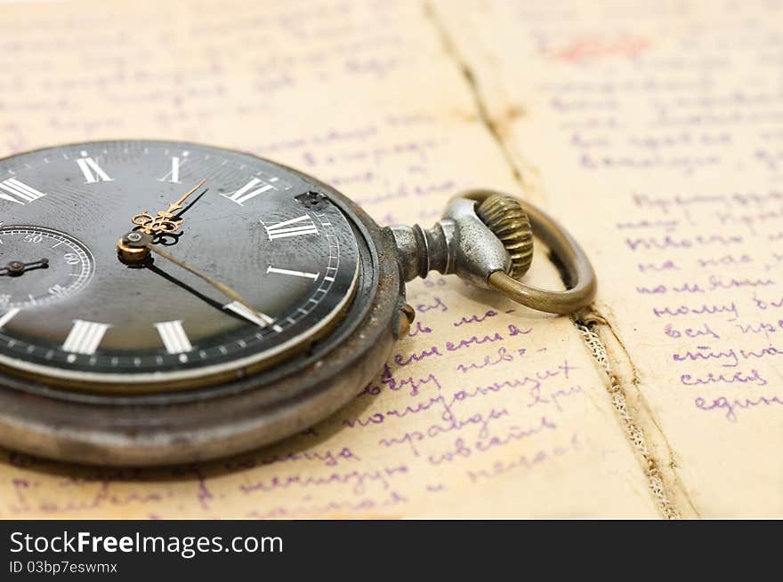 Watch on an old notebook with the text vintage style