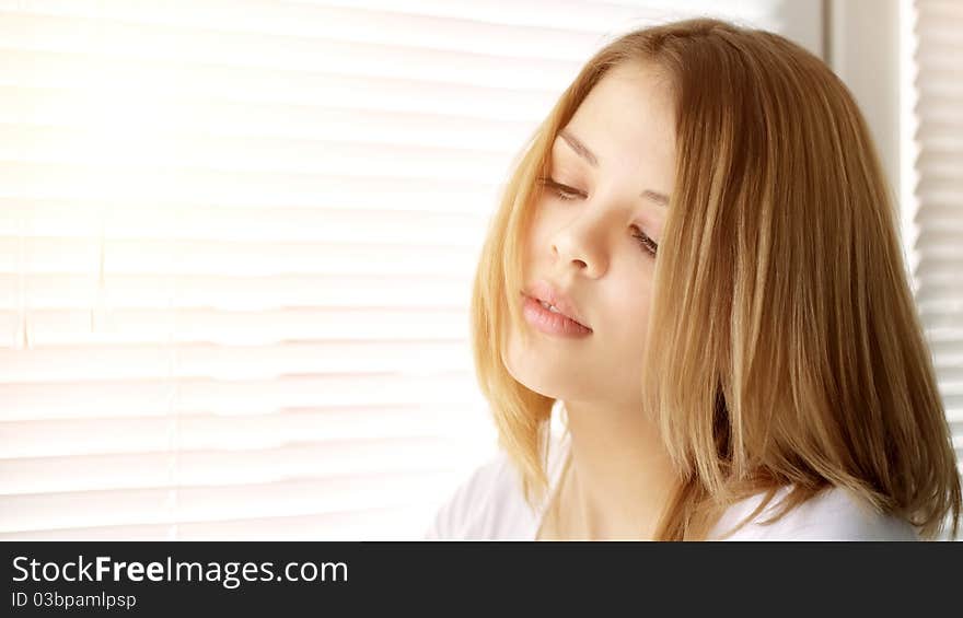 Portrait of attractive girl on a light background