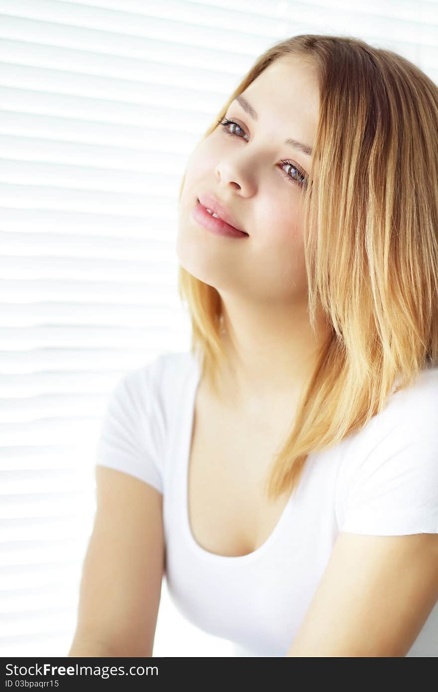 Portrait of attractive girl on a light background