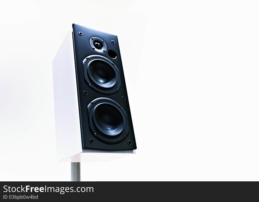 An audio speaker on white background low point view. An audio speaker on white background low point view