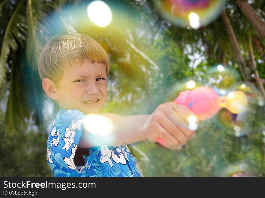 Boy playing with bubbles