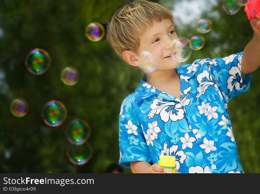 Boy playing with bubbles