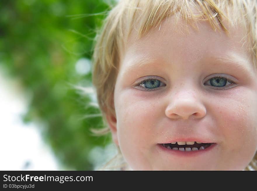 Smiling child portrait on natural background