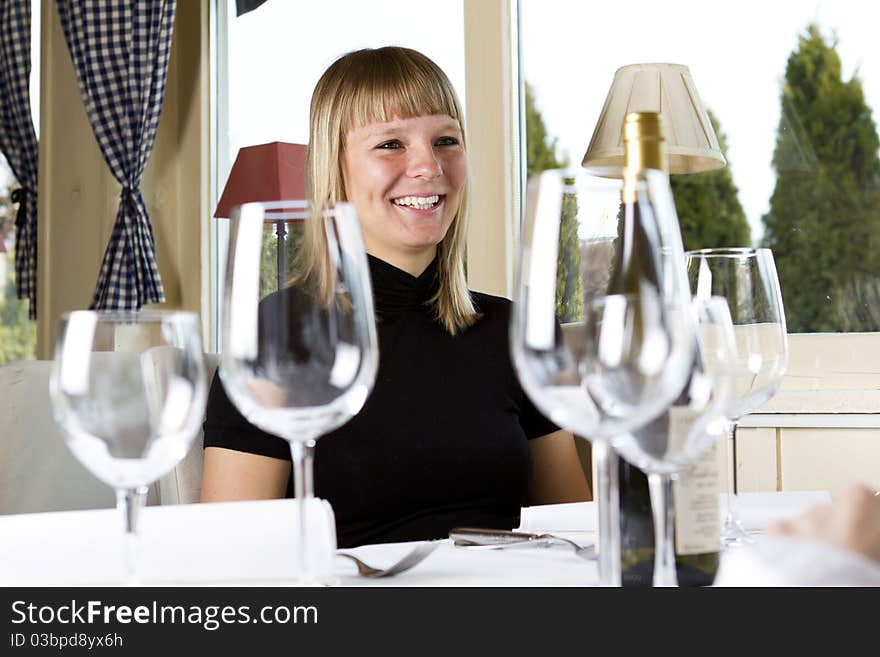 Young girls having dinner in fancy restaurant