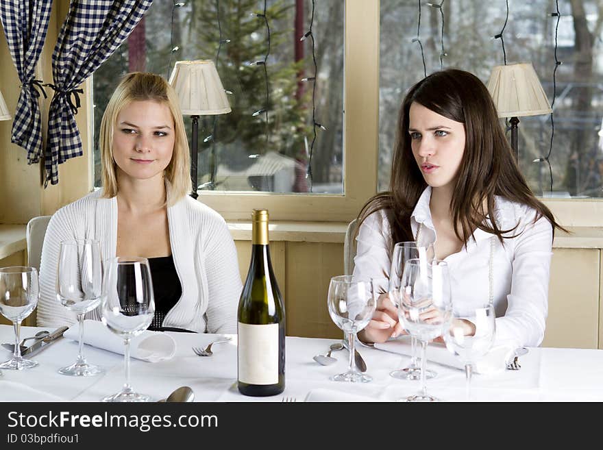 Young Girls Having Dinner In Fancy Restaurant