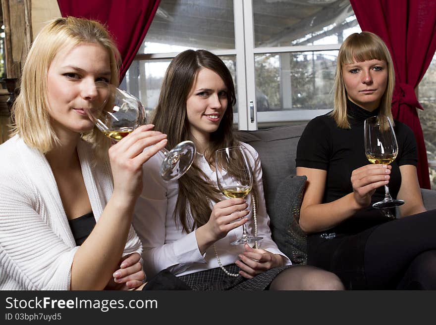 Young girls having dinner in fancy restaurant at the table