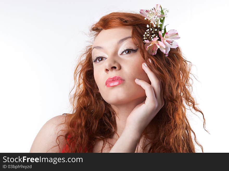 Portrait of beautiful woman with spring flowers on white