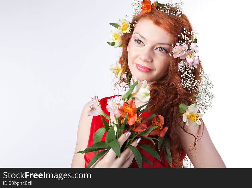 Portrait of beautiful woman with spring flowers