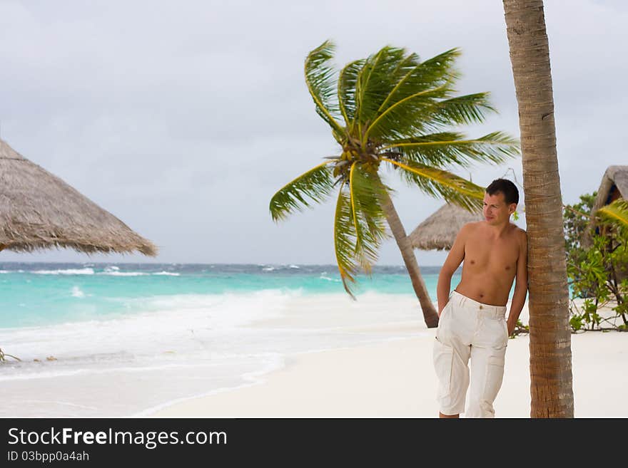 Young Man On A Tropical Beach