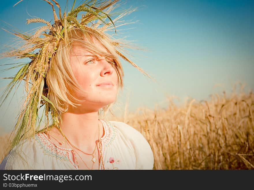 Young woman on wheat field