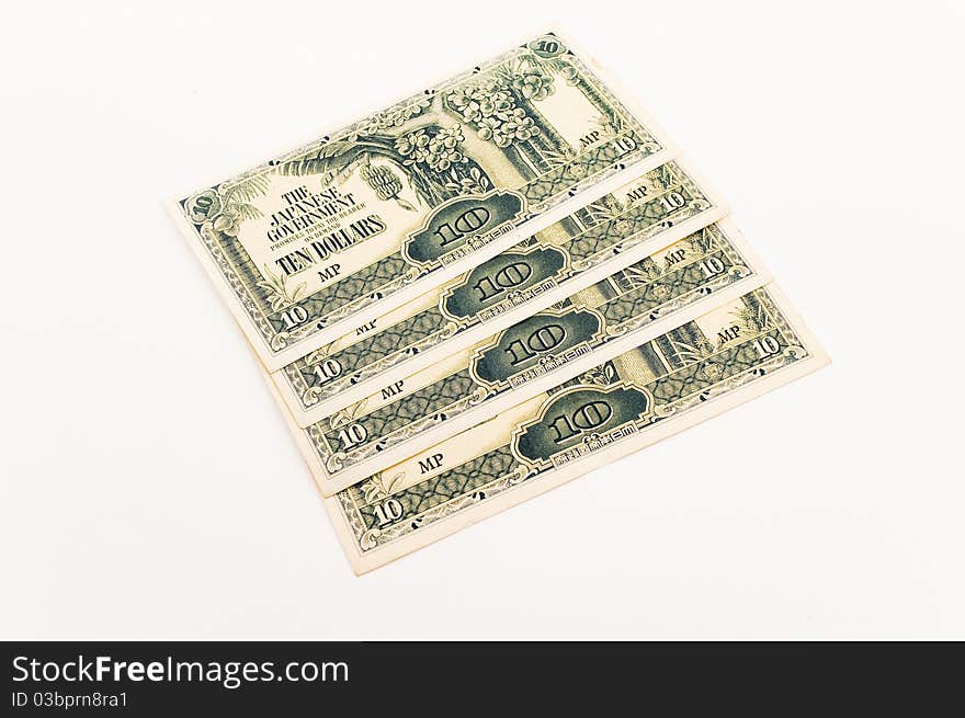 Four ten dollar japanese notes displayed