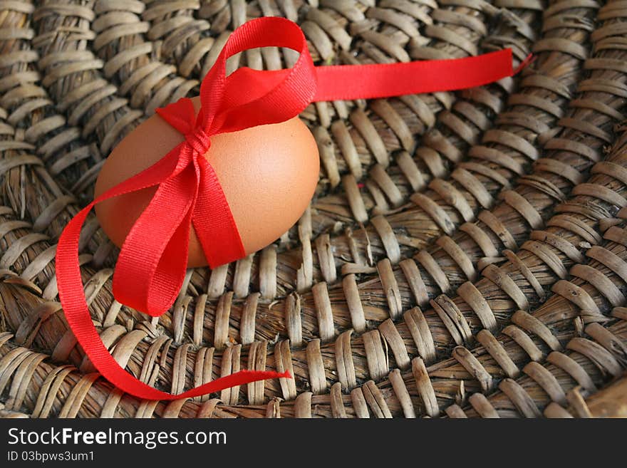 Easter egg with red ribbon