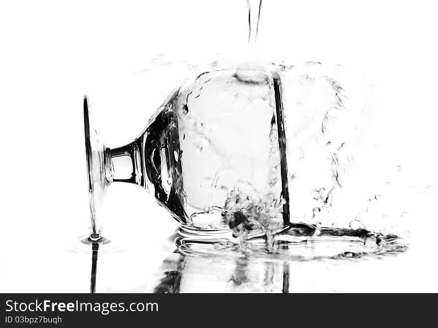 Wine glass with water dropping on it. White background. Studio shot. Wine glass with water dropping on it. White background. Studio shot.