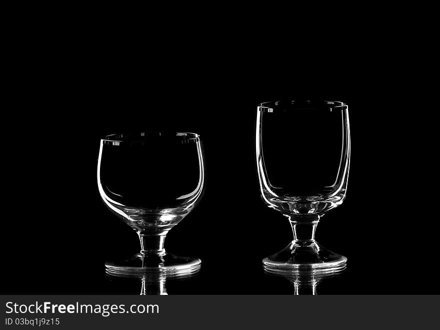 Two empty wine glasses. Blackbackground. Studio shot.