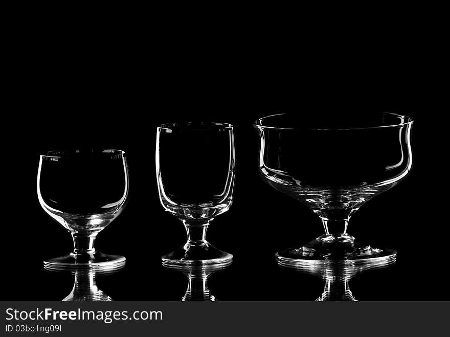 Set of empty wine glasses. Black background. Studio shot.