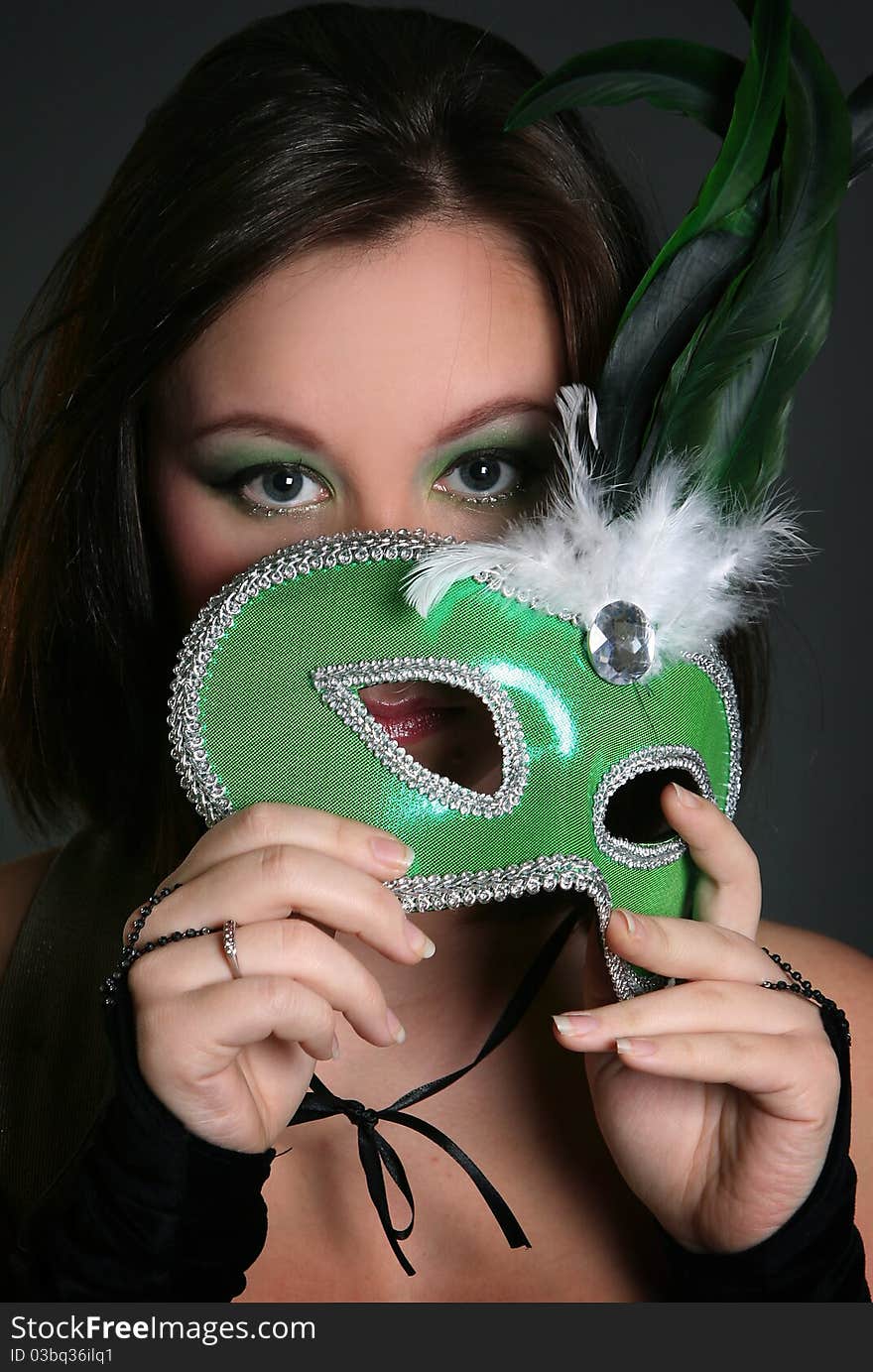 Beautiful young woman wearing mask. Beautiful young woman wearing mask