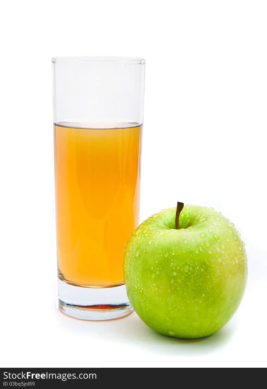 Glass of apple juice with an apple