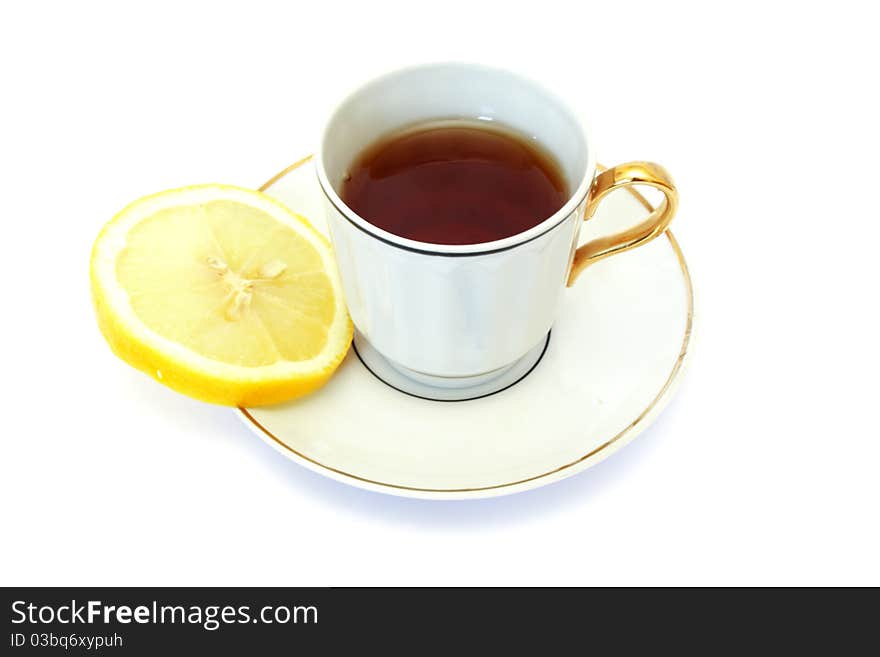 White cup of tea isolated on white with lemon. White cup of tea isolated on white with lemon