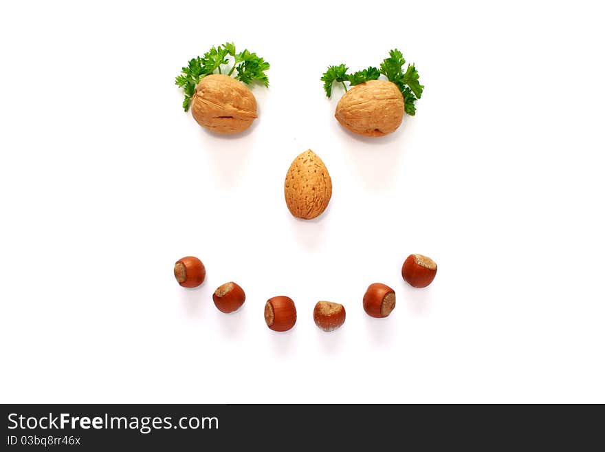 Smiling face made whith help of nuts